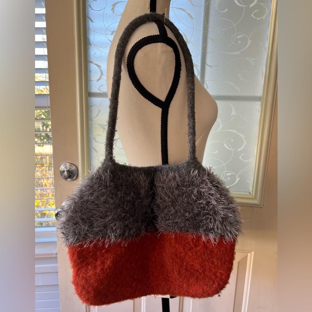 Majolica Collection felted wool and shag fur shoulder bag grey and burnt orange.